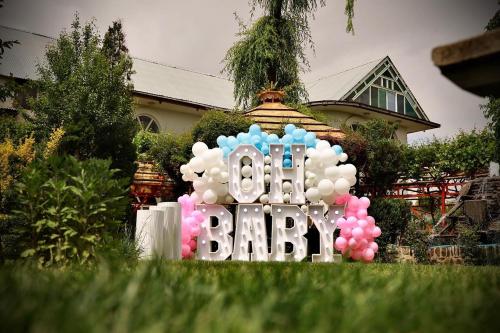 a sign that says birthday in front of a house at Kabul Qargha Palace Hotel, Restaurant and wedding Hall in Kabul
