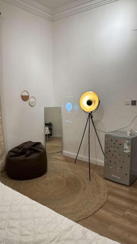 a room with a yellow instrument on a tripod at غرفة نوم مودرن بدخول ذاتي رقم سري in Tabuk