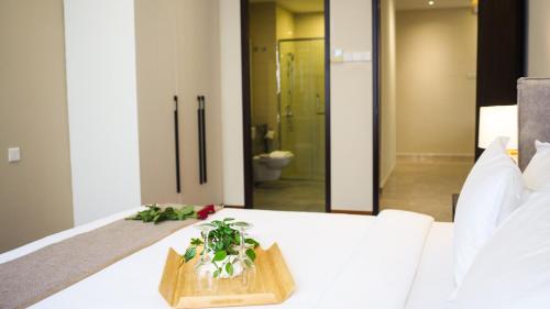 a table with a cutting board on it with a bathroom at TM Persiaran Stonor KLCC - MK HOME in Kuala Lumpur