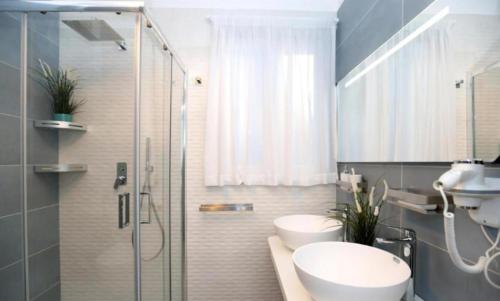 a bathroom with a shower and a sink and a toilet at Villa Dei SRLS in Positano - Camere in Positano
