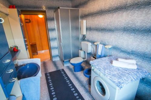 a bathroom with a sink and a toilet and a sink at Apartment Miranda in Slatine