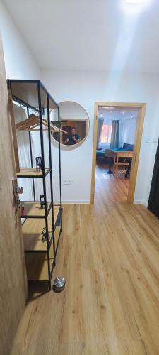 a room with a bunk bed and a wooden floor at Studio Na náměstí in Potštát