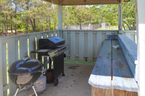 a grill and a smoker on a patio at Whalers Inn - C7928 in Corolla
