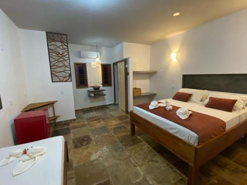 a bedroom with a large bed and a table at casanossa prea in Prea