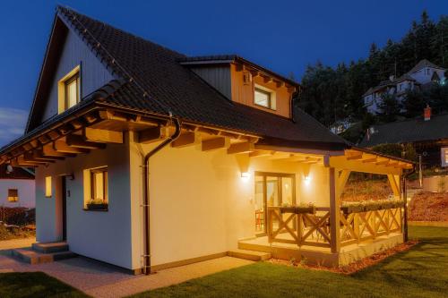 a small house with a gambrel roof at BINDT chalets in Hnilčík
