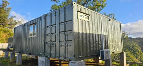 a train car is sitting on some poles at Green Discovery's Birds' Nests in Henrietta
