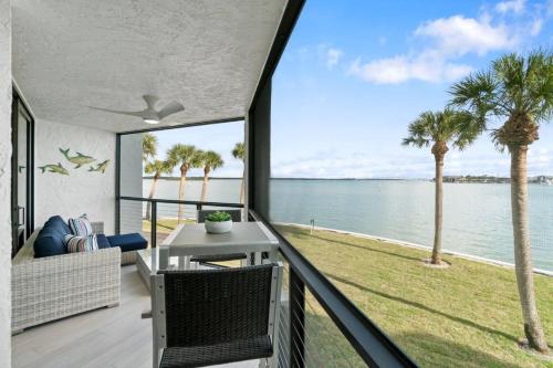 a house with a balcony with a view of the ocean at Riverside Club A209 in Marco Island