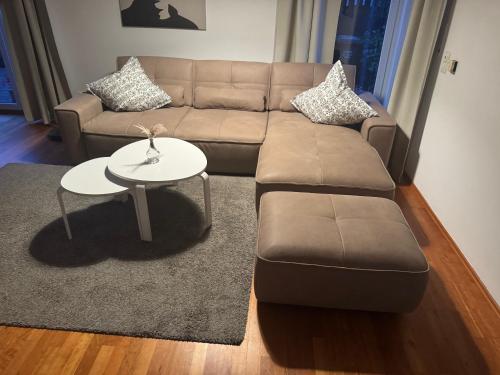 a living room with a couch and a table at Ferienhaus am Emmerbach in Ascheberg