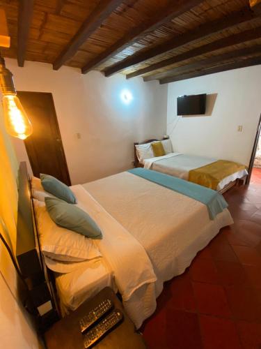 Postel nebo postele na pokoji v ubytování Hospederia Montano Alto