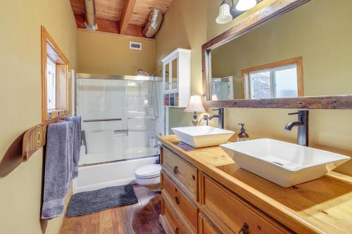 a bathroom with two sinks and a shower at Game Room and 2 Decks Walkable Lake Arrowhead Cabin in Lake Arrowhead