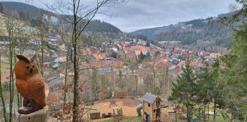 a stuffed squirrel toy sitting on top of a tree at Birkenstübchen in Lautenthal