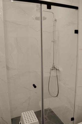 a shower with a glass door in a bathroom at Perfect Stop in Midelt in Midelt