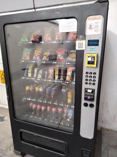 a vending machine filled with food and drinks at Hotel25 in Monterrey