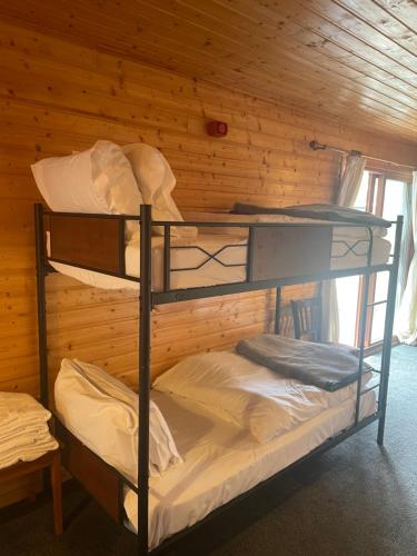 a room with two bunk beds in a cabin at OX Hotel Spean Bridge in Spean Bridge