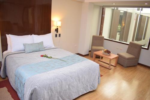Postel nebo postele na pokoji v ubytování Miculla Hotel