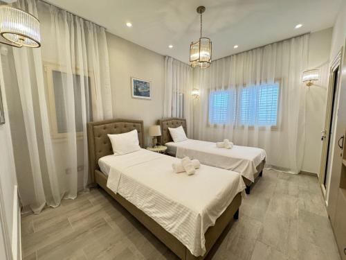 Ένα ή περισσότερα κρεβάτια σε δωμάτιο στο Luxury Villa Aurelia