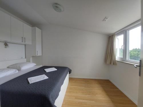 Postel nebo postele na pokoji v ubytování Apartments Oliva