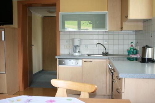 a kitchen with a sink and a counter top at Haus Bergliebe in Schladming