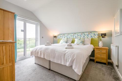 Postel nebo postele na pokoji v ubytování The Snug - Retallack