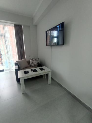 a living room with a couch and a table at New Alvina in Tsaghkadzor