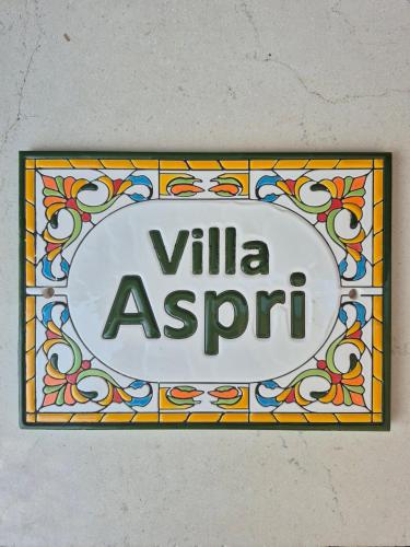 a sign that reads villa asphonia on a wall at Villa Aspri in Nea Kalikratia