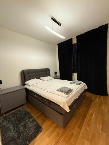 a bedroom with a large bed in a room at Belgrade Waterfront apartments in Belgrade