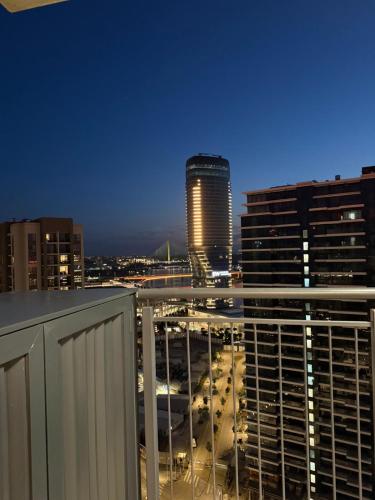 a view of a city skyline at night at Belgrade Waterfront apartments in Belgrade