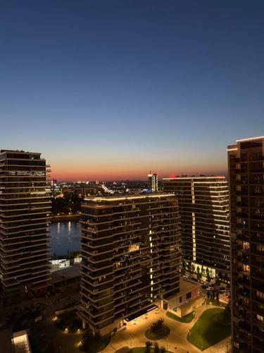a view of a city skyline with tall buildings at Belgrade Waterfront apartments in Belgrade