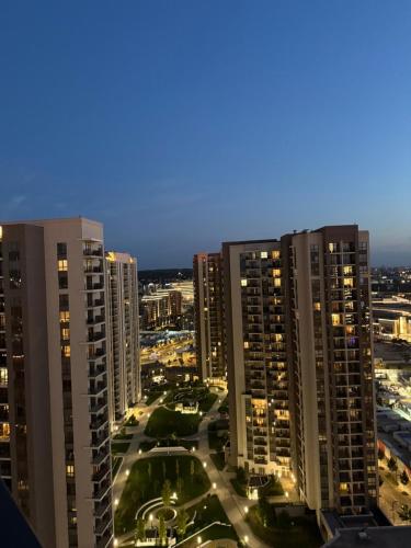 a city skyline at night with tall buildings at Belgrade Waterfront apartments in Belgrade