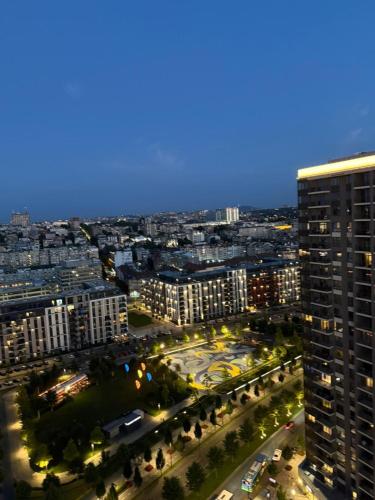 an aerial view of a city at night at Belgrade Waterfront apartments in Belgrade