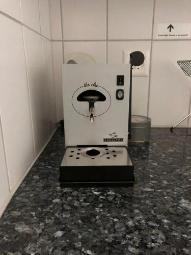 a machine sitting on a counter in a room at Steps To Best Bern Sites And Lots Of Space Too! in Bern
