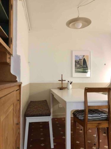 a cross sitting on a table in a room at Steps To Bern's Best Historic Sites! in Bern