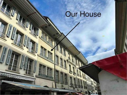 a building with a sign that reads our house at Steps To Bern's Best Historic Sites! in Bern