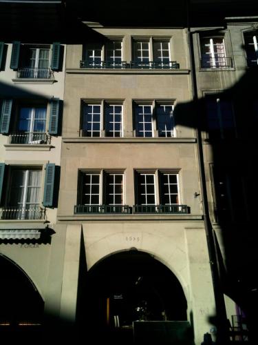 a tall building with windows and balconies on it at Steps To Bern's Best Historic Sites! in Bern