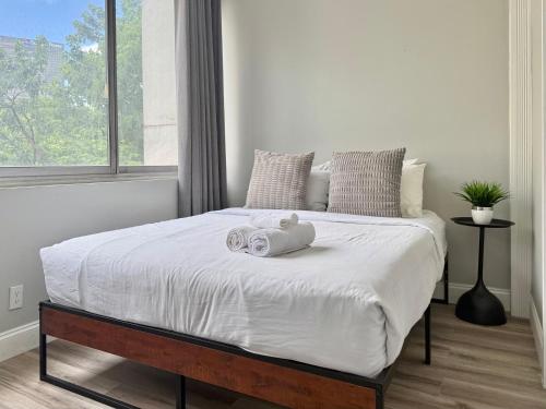 a bedroom with a bed with a stuffed animal on it at Atlanta Downtown! High Rise! Onsite Parking Multi Unit in Atlanta