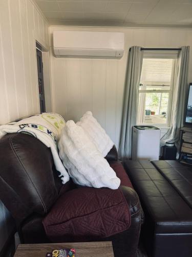 a pile of towels sitting on top of a couch at Cozy house by Crystal Creek in Cle Elum
