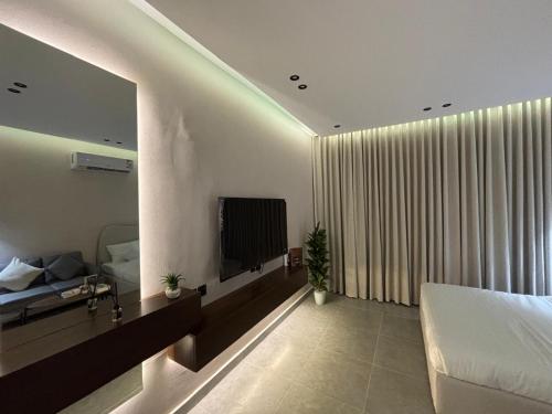 استديو أنيق بتصميم راقي tesisinde bir televizyon ve/veya eğlence merkezi