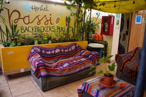 a store with a couch in front of a flower shop at Passion Hostel - Barranco in Lima