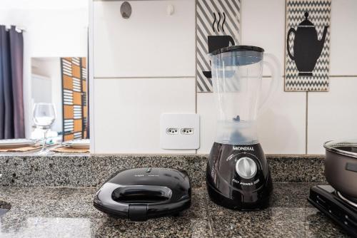 a blender sitting on top of a counter at AQUARELA BELA VISTA in Sao Paulo