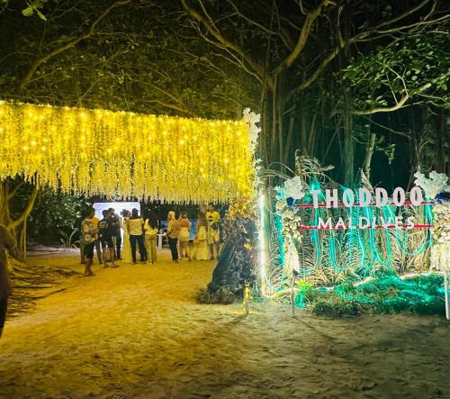 a wedding venue with a tree with lights at Sunny Beach Thoddoo in Thoddoo