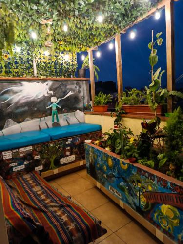 a room filled with lots of plants in a room at Passion Hostel - Barranco in Lima