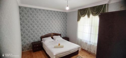 Ένα ή περισσότερα κρεβάτια σε δωμάτιο στο Gabala Mountains Villa