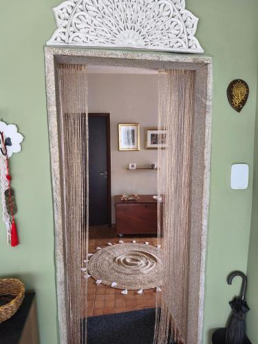 an ornate mirror in a room with a table at O Remanso Devesa in Pontevedra