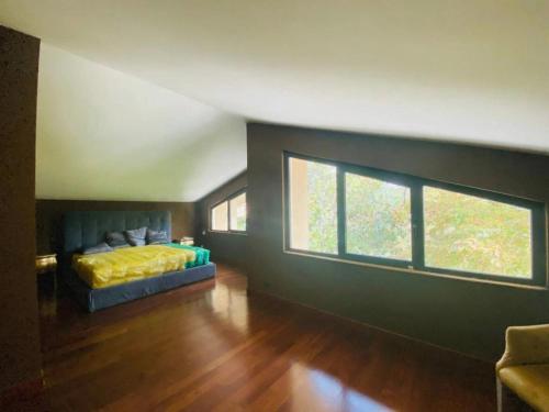 a bedroom with a bed and a large window at B&B Family Villa perfectly located in Rome