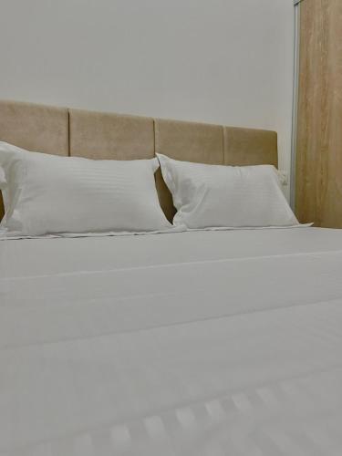 Llit o llits en una habitació de Chez Boubou Studio