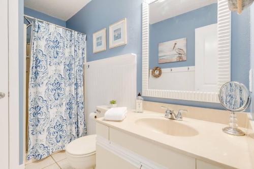 a bathroom with a sink and a toilet at Sounds Great! in Duck