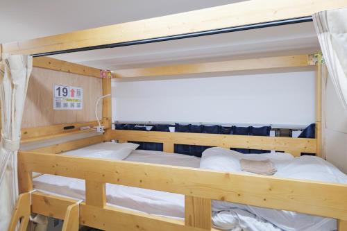 a bunk bed in a room with at Dormitory サークルテン- Share Room For Male Only 男性専用ドミトリー in Tokyo