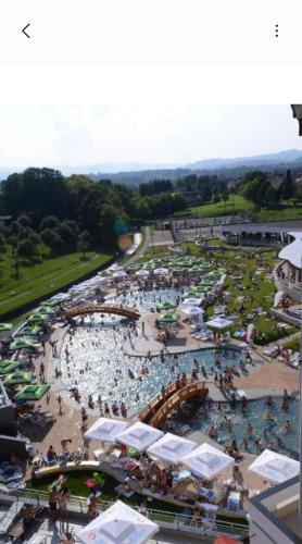 an aerial view of a swimming pool with people in it at Stan na dan Miki M in Teslić