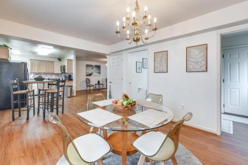 a dining room and living room with a table and chairs at 1 Mi to Colonial Beach Boardwalk! Cozy Family Home in Colonial Beach