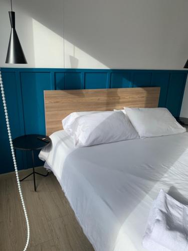 Un ou plusieurs lits dans un hébergement de l'établissement Tekto Apartamento con Balcón y Vista hermosa a las montañas de Bogotá
